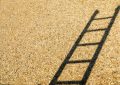 black metal frame on brown sand