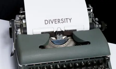 green and white typewriter on white table